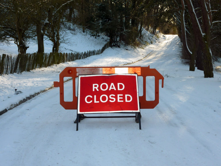 Road Closed sign in snow